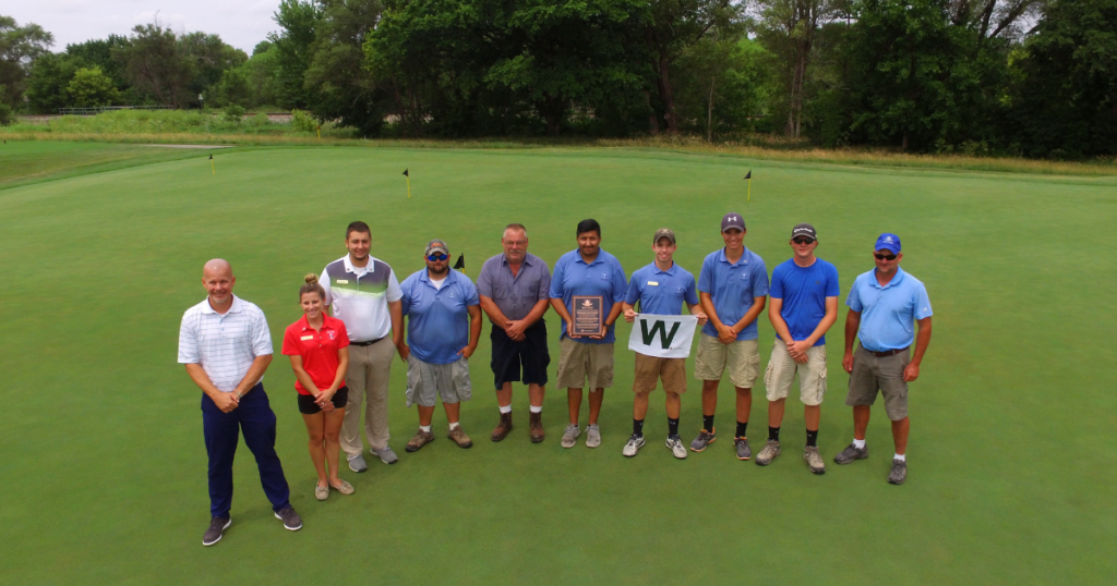 The team at Sand Creek Station in Newton, Kansas, flying the W flag