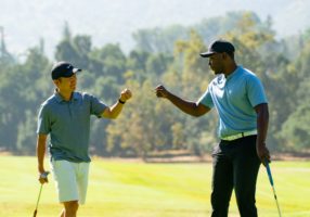 Two golfers celebrating a good round.